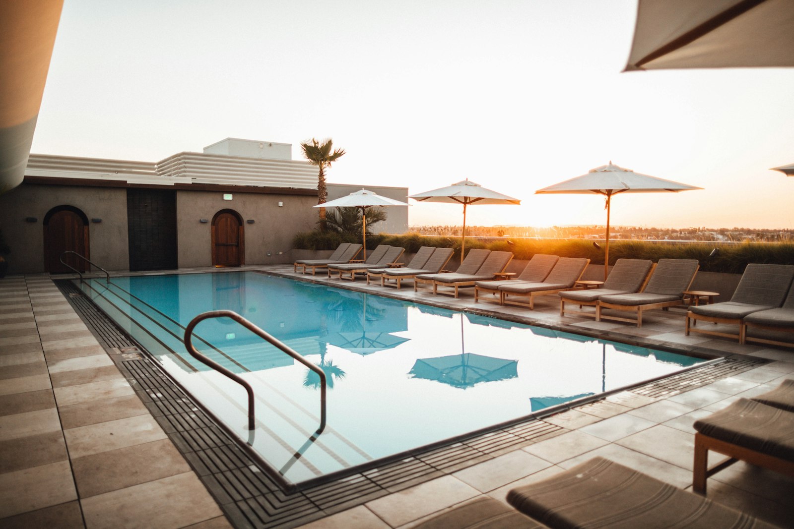 Resort swimming pool at sunset being filled with sweet water in Dubai